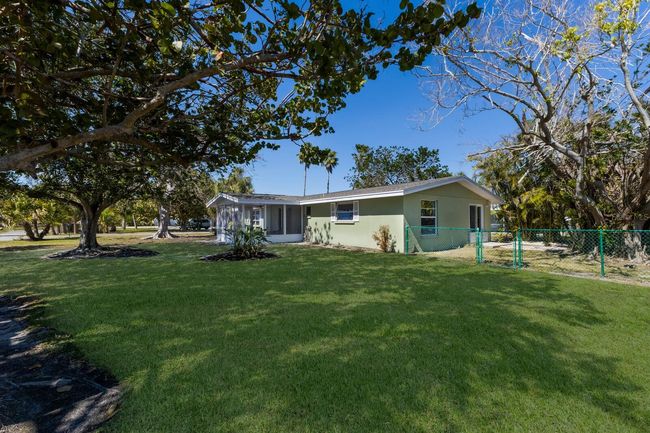 The large beautiful yard is a high point of this lovely property. The fenced backyard is useful for both pets and privacy. | Image 21