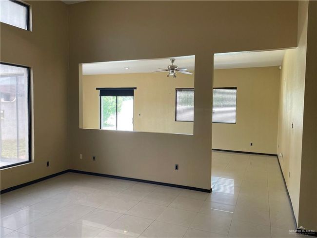 Empty room featuring ceiling fan and baseboards | Image 28