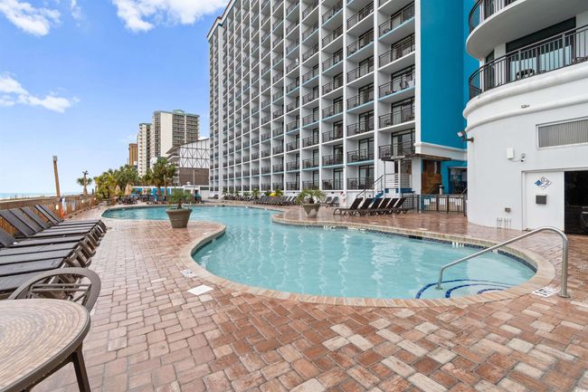 Community pool featuring a patio area | Image 24