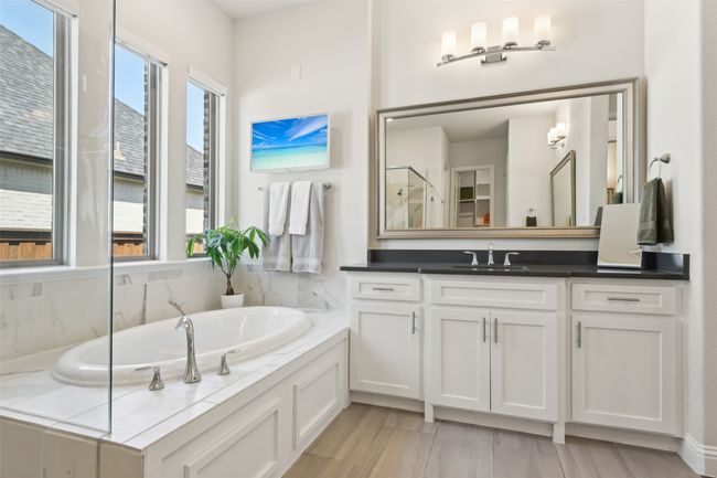 Bathroom with vanity and a bath | Image 20