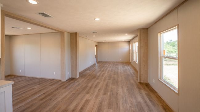 Spare room featuring light wood-type flooring, recessed lighting, and a decorative wall | Image 22