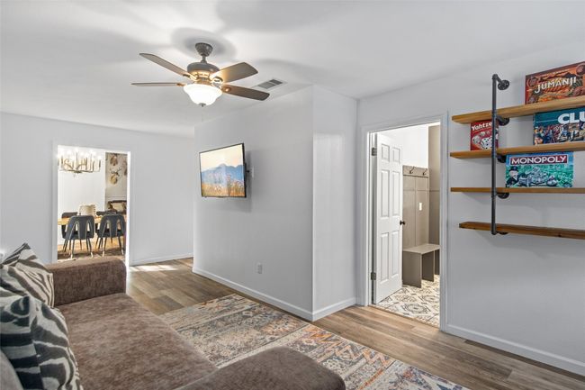 Secondary living room as easy access to laundry/mud room and formal dining room. | Image 24
