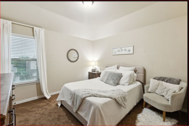 Bedroom with dark carpet and baseboards | Image 24