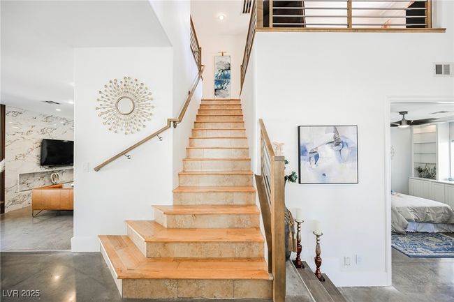Staircase with finished wood floors and visible vents | Image 37