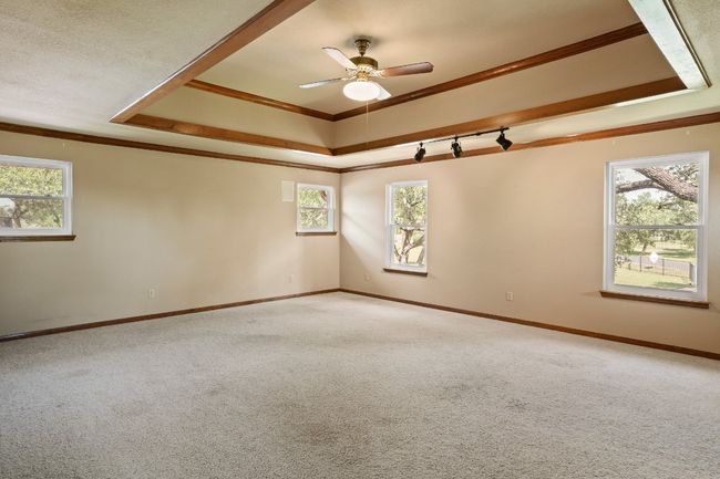 Game room with access to balcony and has wet bar, closet, and half bath | Image 16