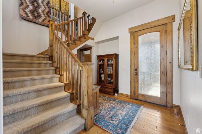 Entrance foyer with wood-type flooring, baseboards, and a healthy amount of sunlight | Image 20