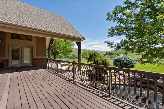 Wooden terrace featuring a mountain view and french doors | Image 73