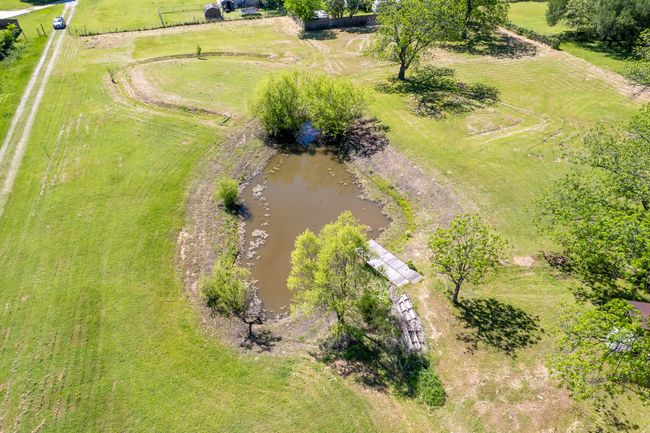 View of rural area with a nearby body of water | Image 14