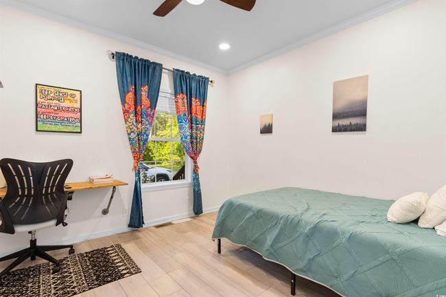 Bedroom with ornamental molding, baseboards, wood finished floors, recessed lighting, and ceiling fan | Image 20