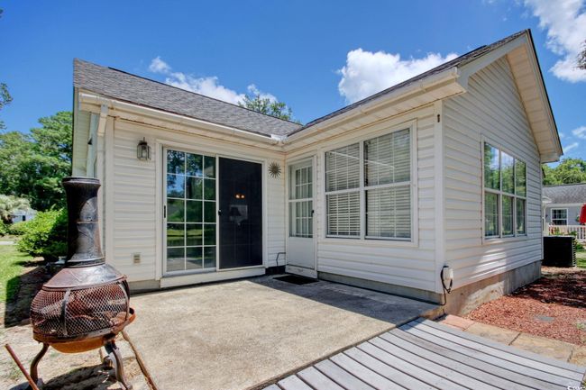 Rear view of property with a patio area and roof with shingles | Image 31