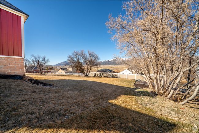 View of yard featuring fence | Image 32