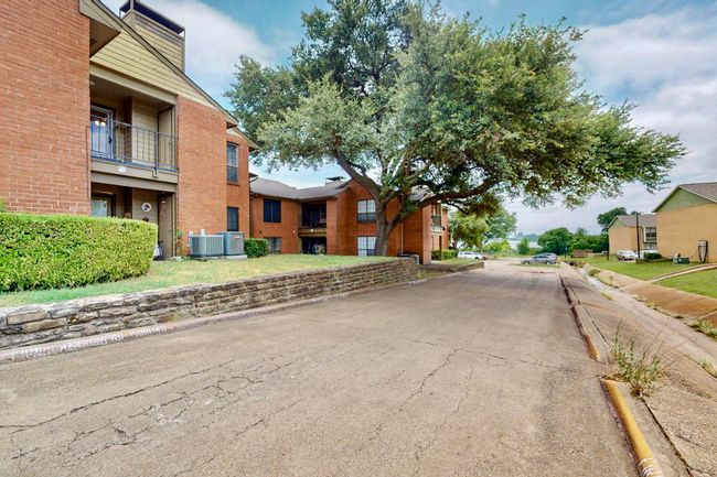 View of asphalt street featuring curbs | Image 11