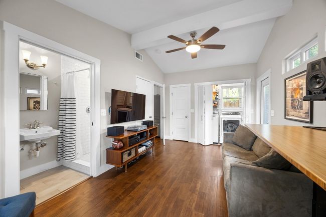 Living room featuring wood finished floors and a ceiling fan | Image 18