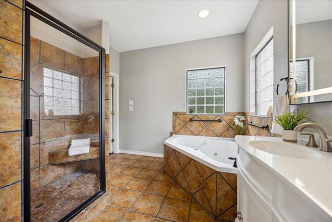 This primary ensuite even has a beautiful, large custom shower. | Image 22