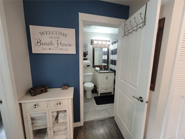 Bathroom with hardwood / wood-style flooring, toilet, and vanity | Image 11