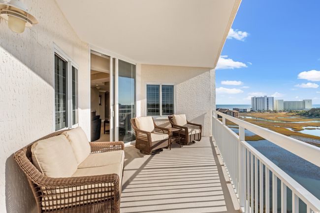 Balcony featuring a water view | Image 14