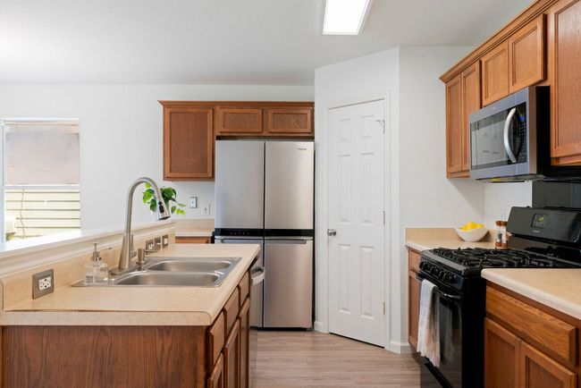 A rare neighborhood perk, the kitchen includes gas appliances for added function and flexibility. | Image 5