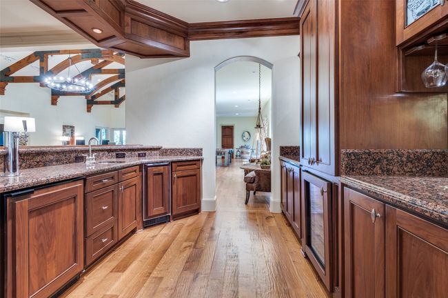 Full Walk-In Bar has wine frig, beverage frig, sink, keg frig w/tap and ice maker | Image 17