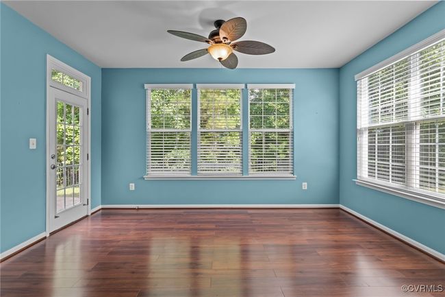 Unfurnished room with a ceiling fan and wood finished floors | Image 14