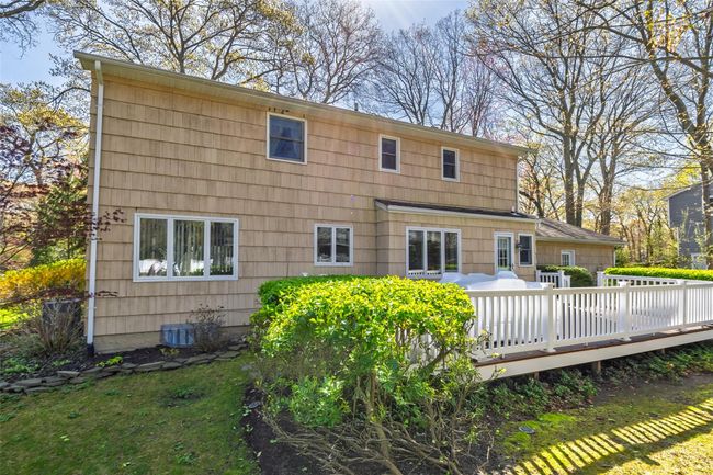 Rear view of property featuring a wooden deck | Image 37