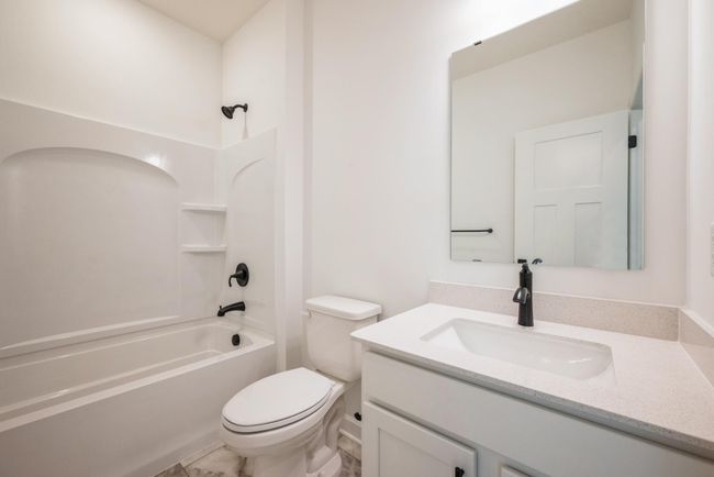 Photo of actual home. The secondary bath. | Image 12