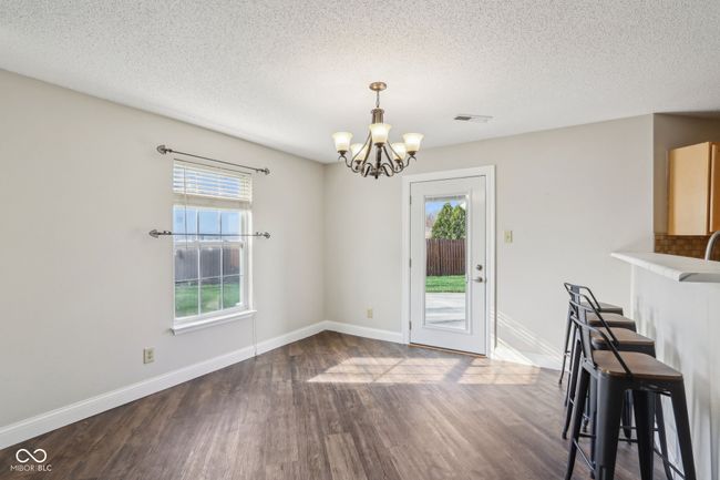 Kitchen nook, do you prefer one dining area, or two? or maybe even three ... Bar Stools are included. | Image 20