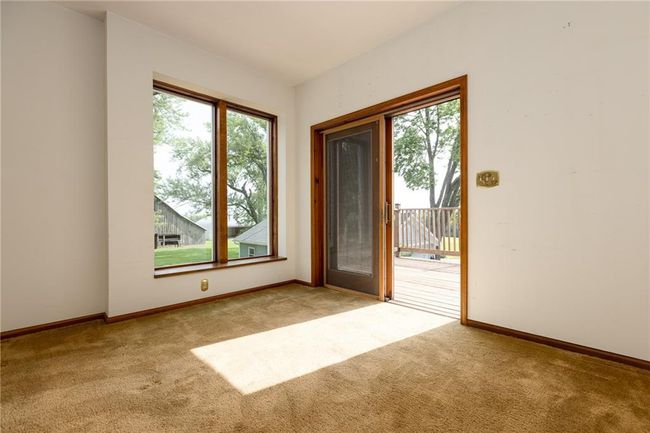 Empty room with light colored carpet and plenty of natural light | Image 46