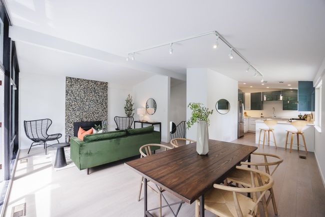 Dining space with rail lighting and light wood-style flooring | Image 7
