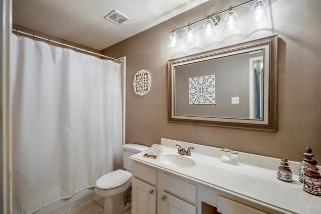 The upstairs full bath offers plenty of counter space, providing both functionality and room for storage. | Image 30