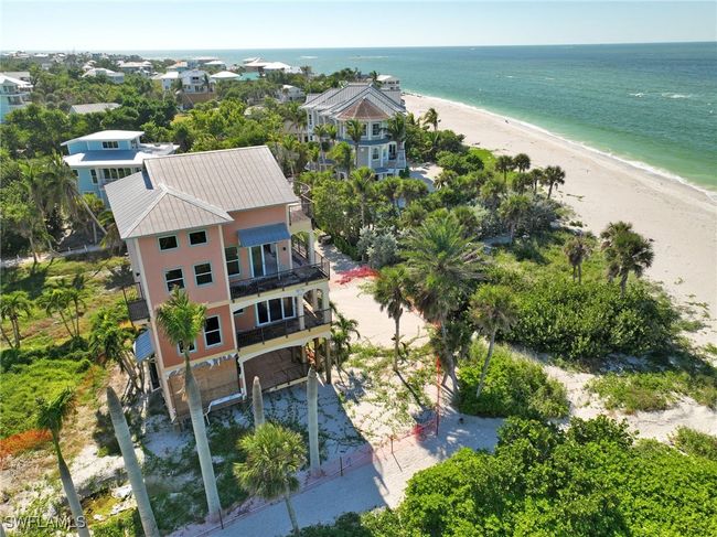 Aerial view featuring a view of the beach and a water view | Image 13