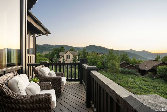 Deck at dusk with a mountain view | Image 19