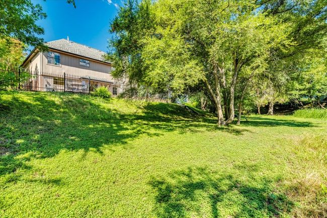 A view of the back of the house from the lower yard behind the home. | Image 36