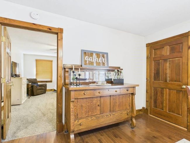 Hutch in dining area and view of door to attached garage | Image 30