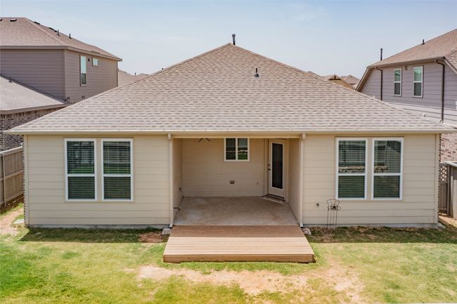 Back of property with a shingled roof and a deck | Image 27