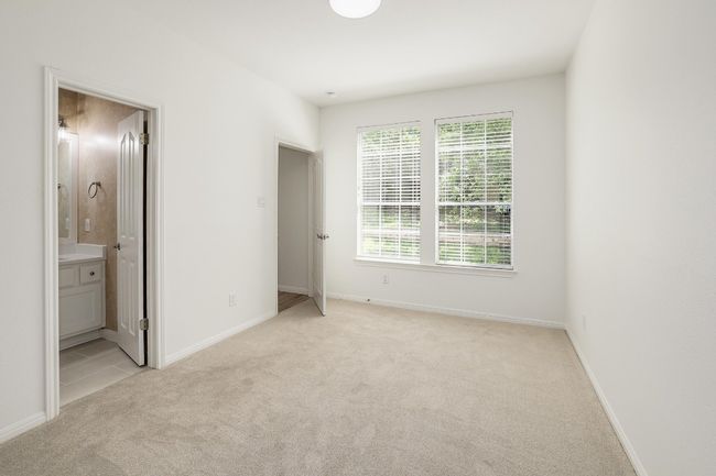Main floor bedroom with en suite bathroom | Image 14