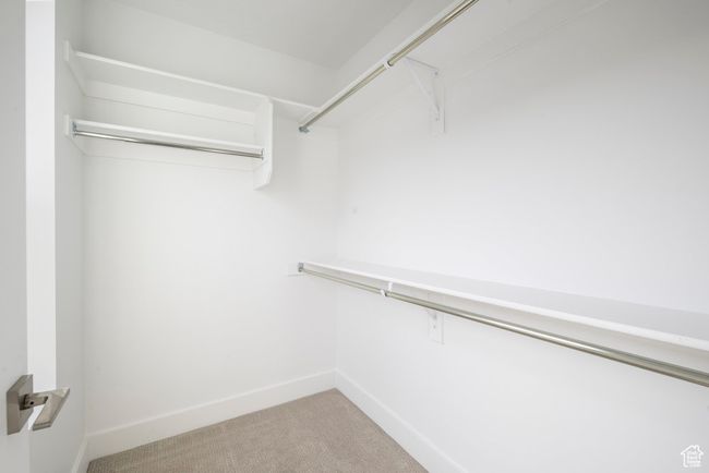 Walk in closet with carpet flooring | Image 13