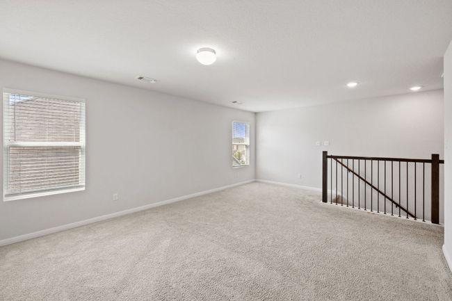 Empty room with visible vents, baseboards, carpet flooring, and recessed lighting | Image 19