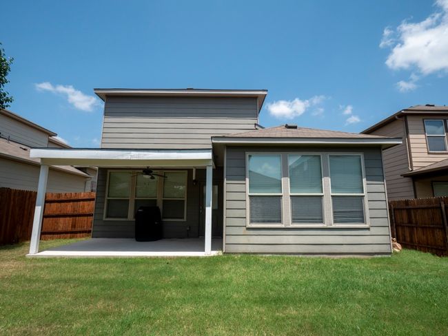 Rear view of property with a ceiling fan and a patio area | Image 17