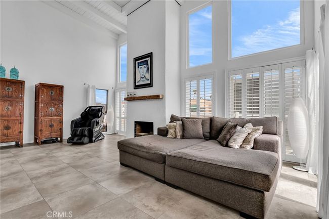 Living room provides a light and airy feeling with vaulted ceilings and Open space | Image 11