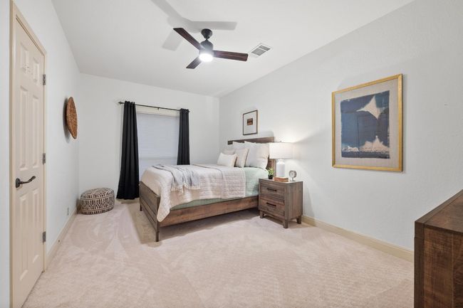 Bedroom featuring carpet and ceiling fan | Image 25