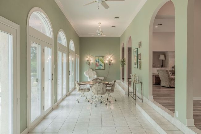 Sunroom / solarium with french doors and arched walkways | Image 11