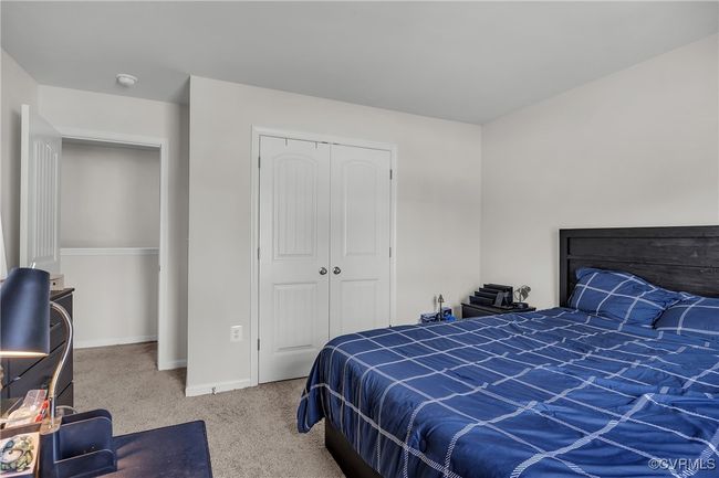 Bedroom featuring a closet, carpet floors, and baseboards | Image 17