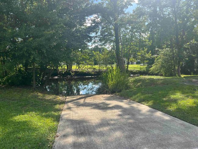 View of green lawn featuring a water view | Image 37