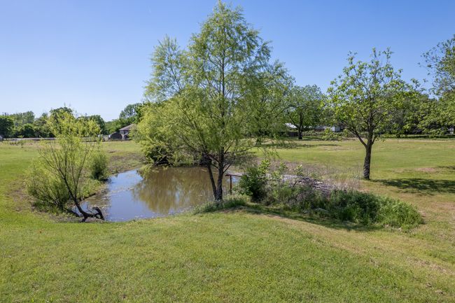 View of grassy yard with a water view | Image 24