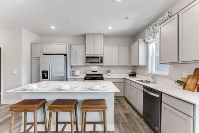 Beautiful and functional. Lots of cabinet space plus a walk-in pantry. | Image 1