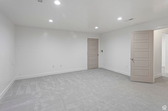 Empty room featuring visible vents, recessed lighting, light carpet, and baseboards | Image 35