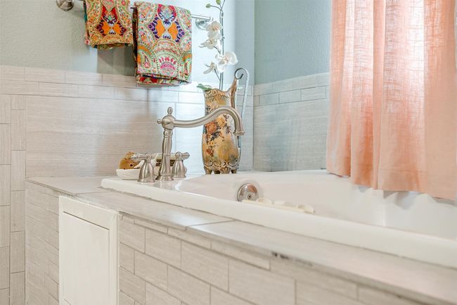 Bathroom featuring tile walls and a sink | Image 13