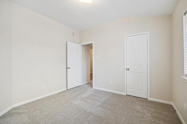 Another view of the secondary bedroom from a different angle. Fresh new interior paint and new carpet. No carpet shampoo needed! Your sleeping quarters are ready for move in! | Image 19