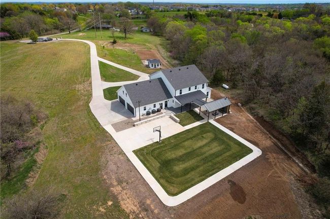Aerial view of property and surrounding area with a heavily wooded area | Image 67