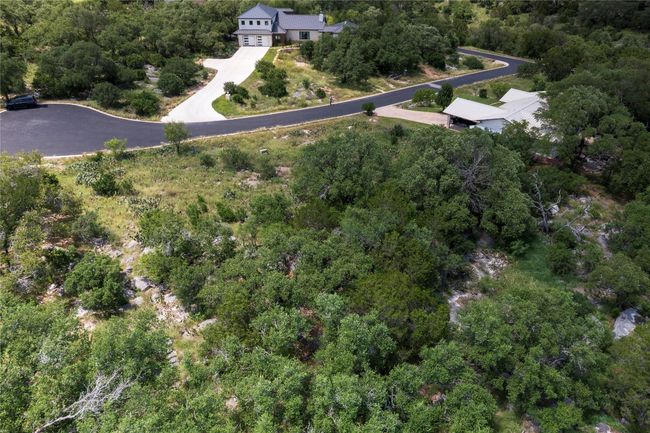 Aerial view of property and surrounding area featuring a forest | Image 10